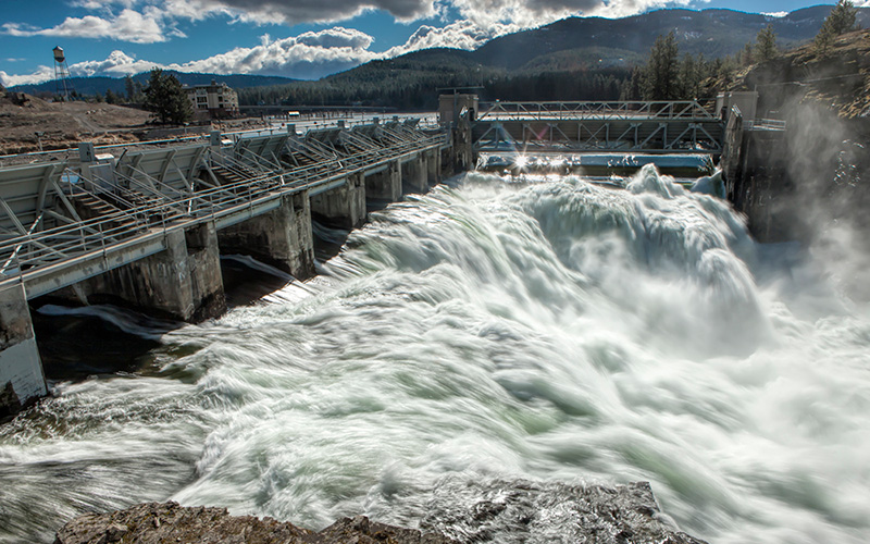The rushing water of the Spokane River moving through the Post Falls Dam in Idaho.